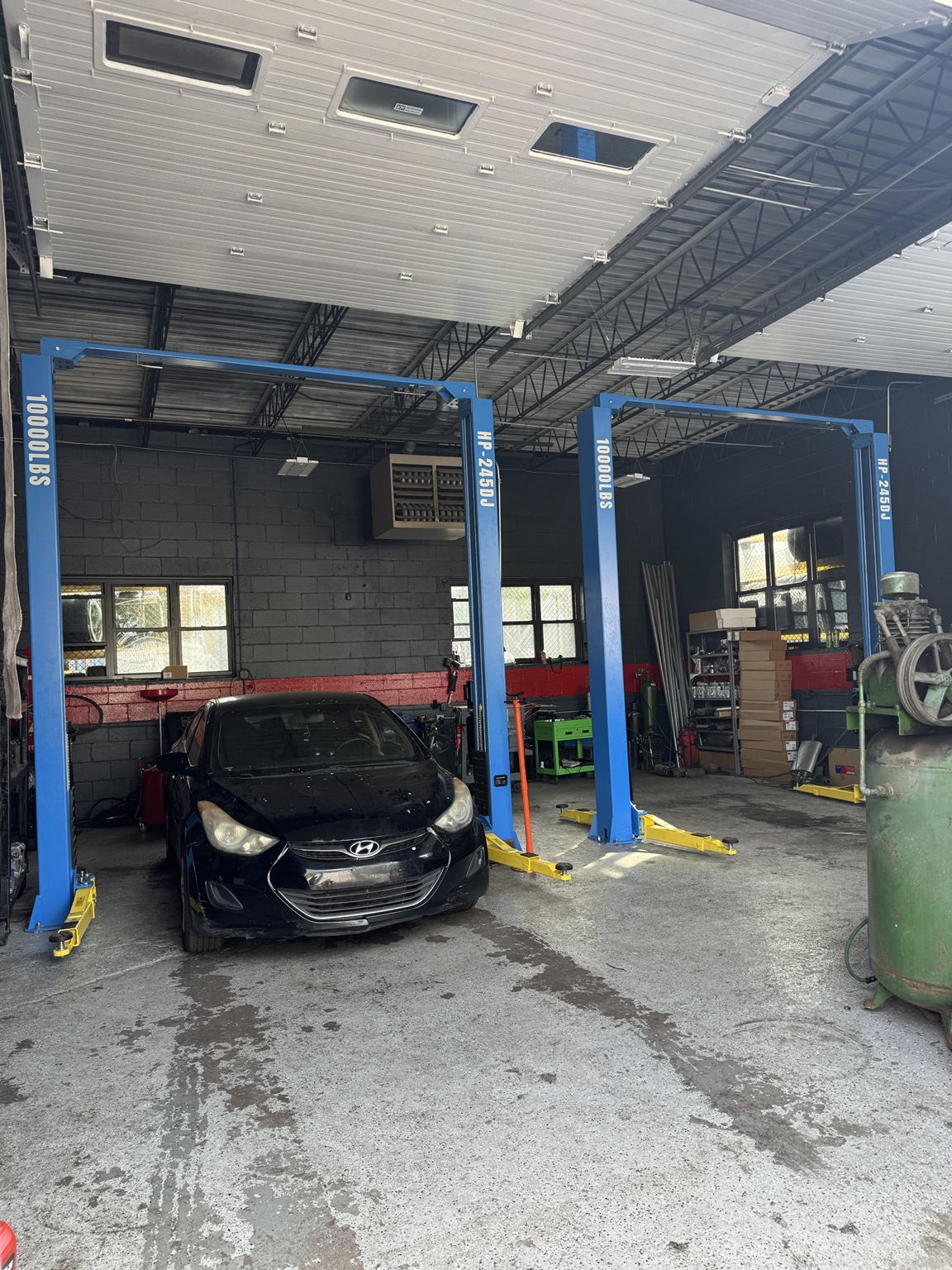 Actual Marquez & Sons mechanic service bays and automotive lifts
